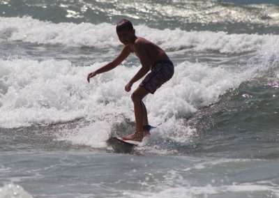 boy-surfing-lesson-wave